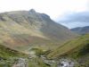 Halfway up Rossett Gill looking back down Mickeldore with the sun shining on Pike Of Stickle